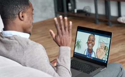 young man talking doctor via video call