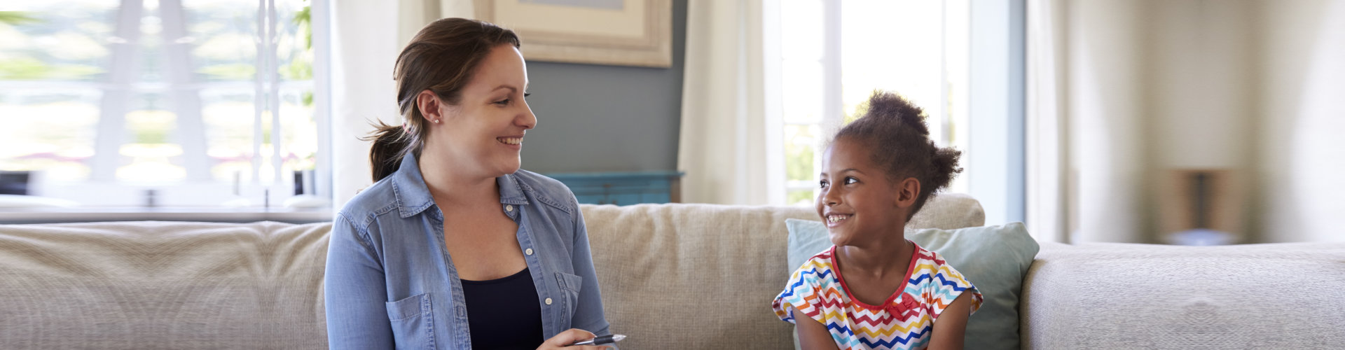 Young Girl Talking With Counselor At Home