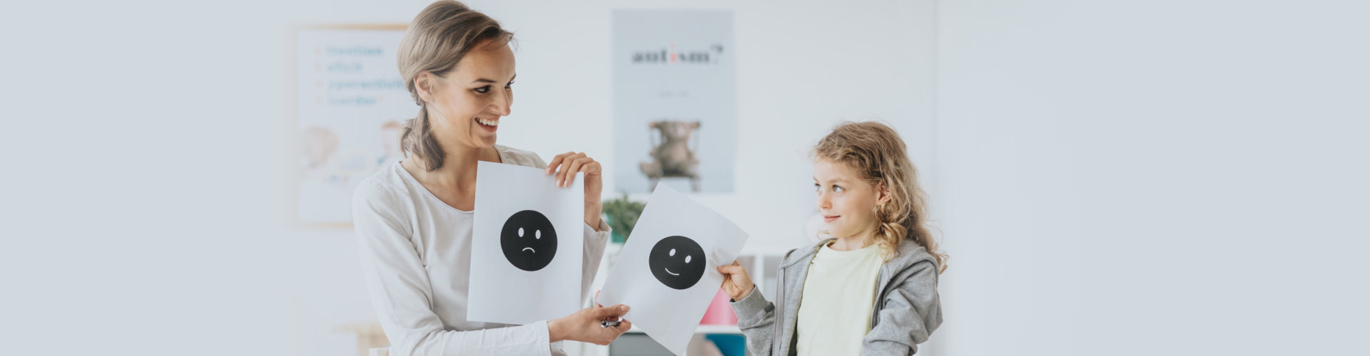 a female psychologist talking about feelings with the little girl